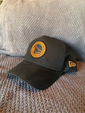 New Era Black Trucker Cap with Gold Patch